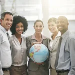 Cropped portrait of a businesswoman holding a glob 2026 01 09 11 45 42 utc - Hvordan finne gode samarbeidspartnere for bedriften