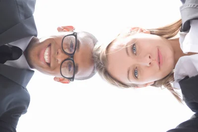 Low angle view of young businesspeople looking at 2026 01 11 09 59 49 utc - Konflikttrappen forklart: trinn, tegn og tiltak