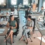 Open office space policy business people having in 2026 01 09 11 06 49 utc - Hvordan sette opp timeføring og prosjektøkonomi i et SMB‑vennli...