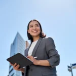Smiling young asian businesswoman using digital ta 2026 03 18 16 03 17 utc 1 - Åpne data for bedrifter: data.norge og automatisk uttrekk (cu...